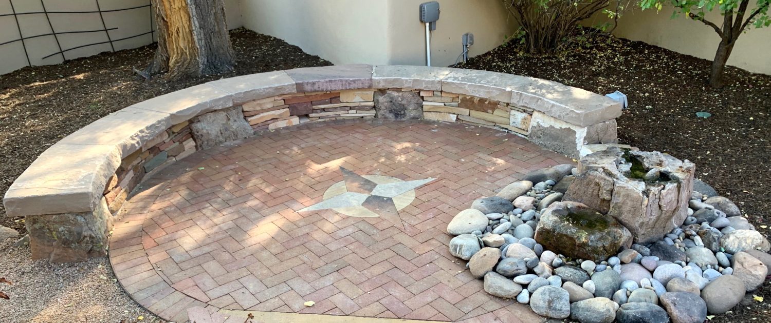 Stone sitting wall, water feature, patio stone sitting wall brick patio compass rose water feature